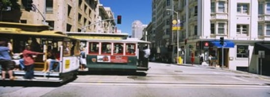 Two cable cars on a road Downtown San Francisco California USA Canvas Art - Panoramic Images (36 x 13)