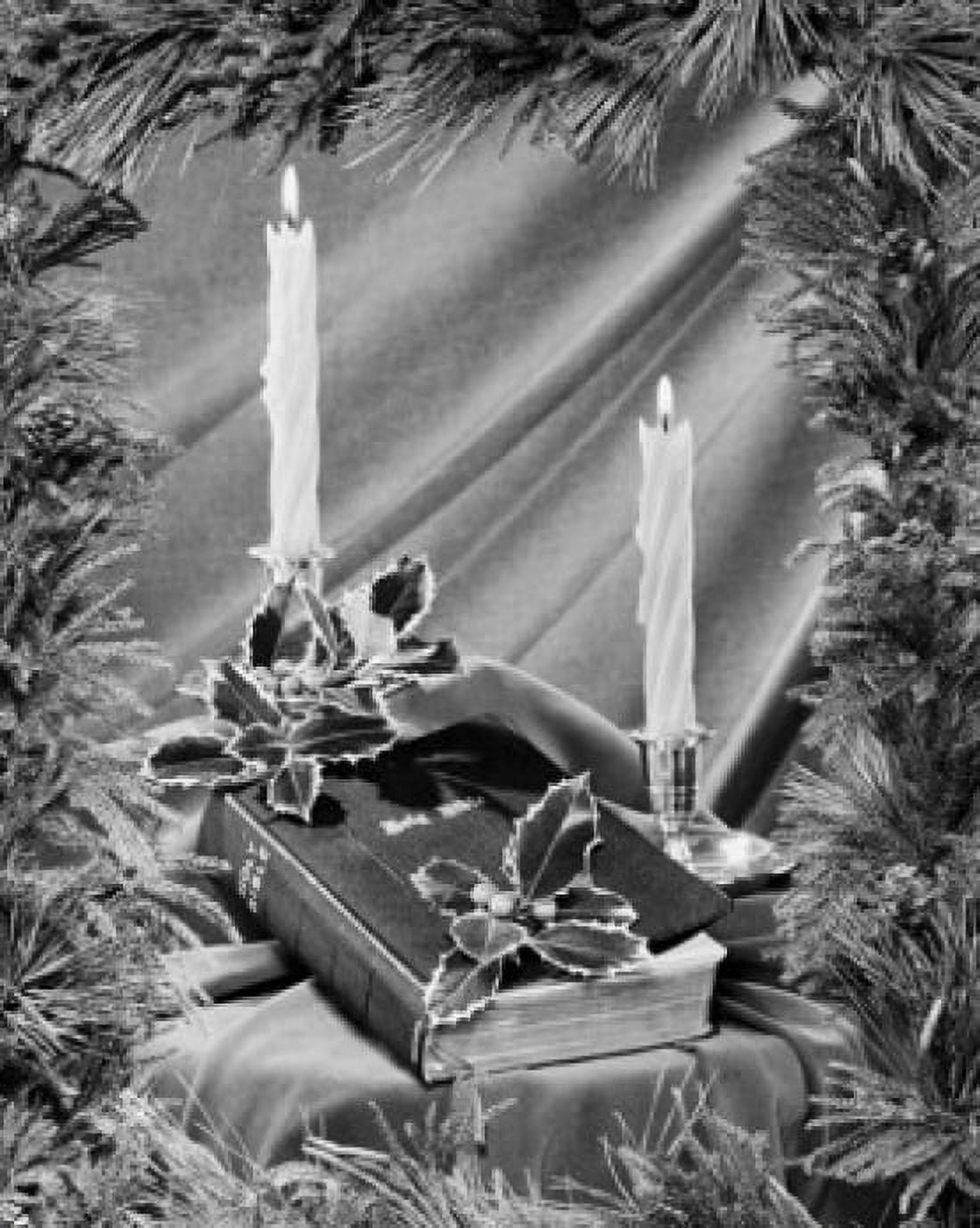 Two candles burning near a Bible Canvas Art - (18 x 24)
