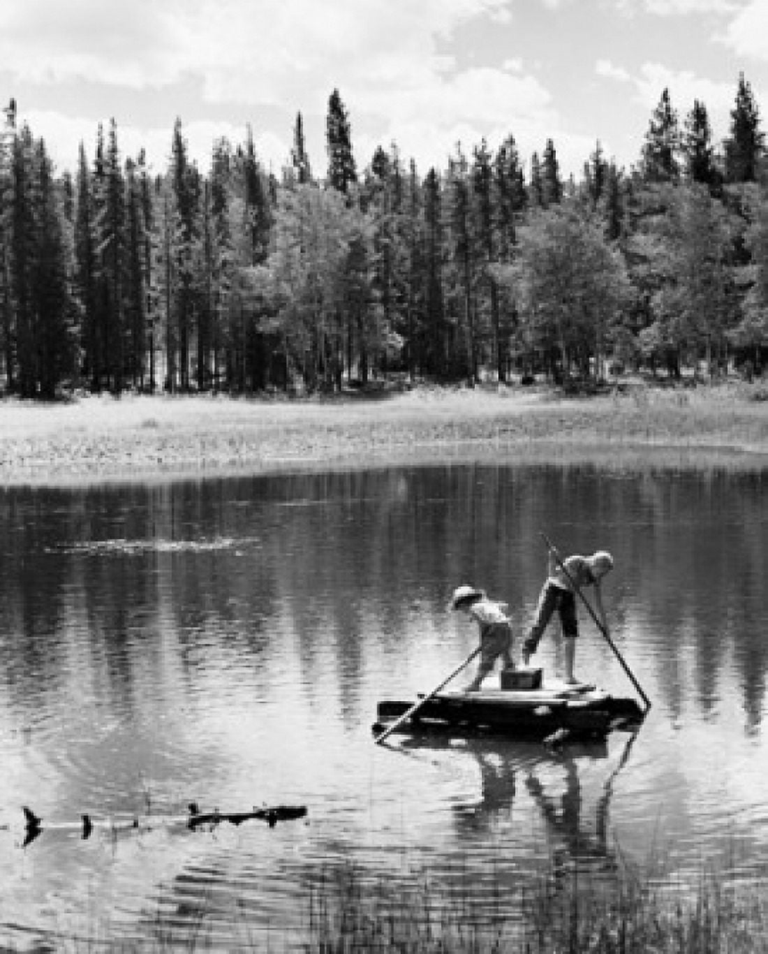 Two children rowing a wooden raft Canvas Art - (18 x 24)