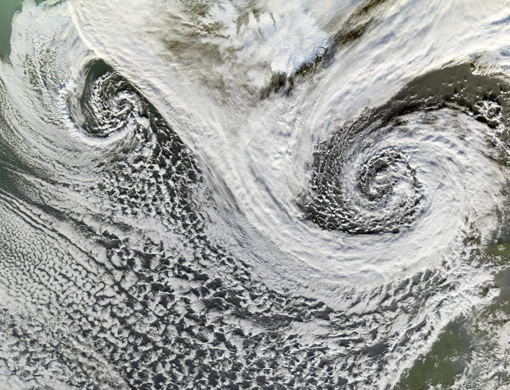 Two cyclones formed in tandem south of Iceland Scotland appears in the lower right Canvas Art - Stocktrek Images (32 x 25)