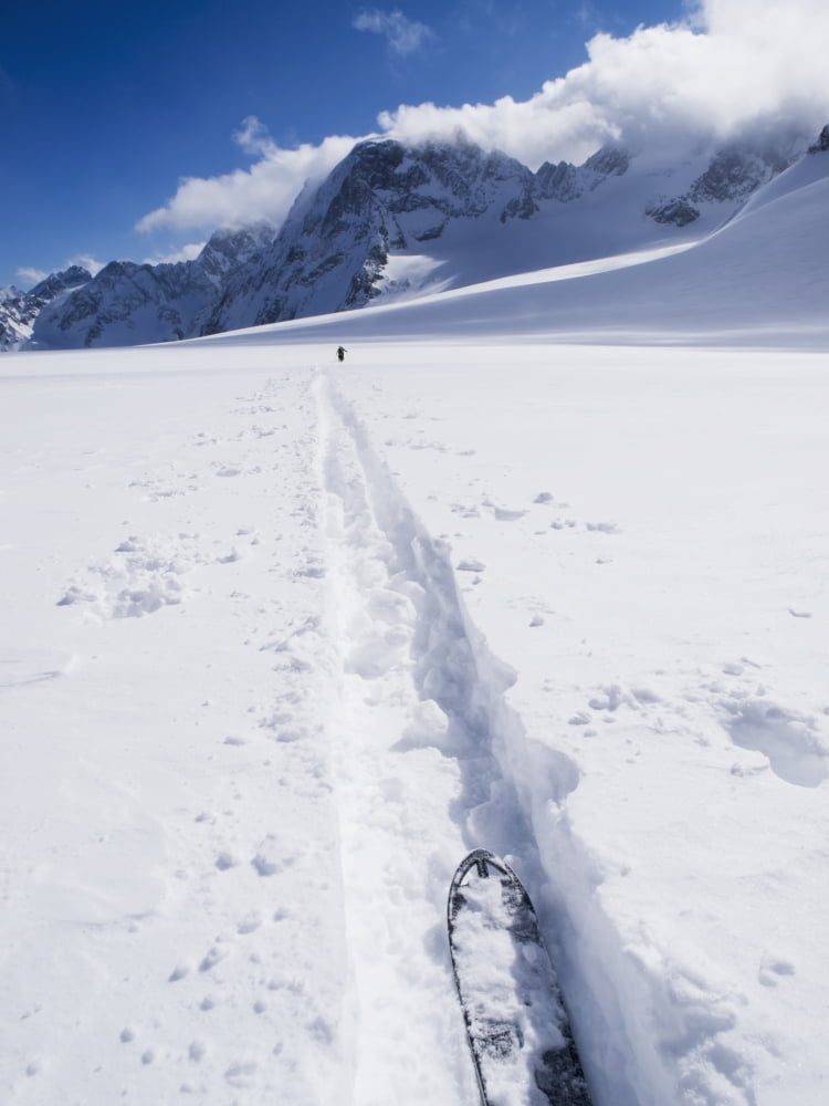 Two distant skiers ski touring across the Ottemma glacier with skinning tracks Switzerland Canvas Art - Penny Kendall Design Pics (26 x 34)