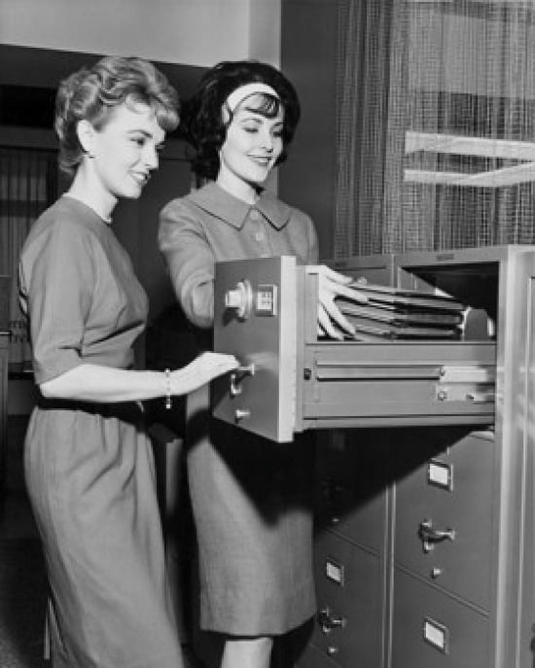 Two female office workers arranging files in filing cabinet Canvas Art -  (18 x 24)