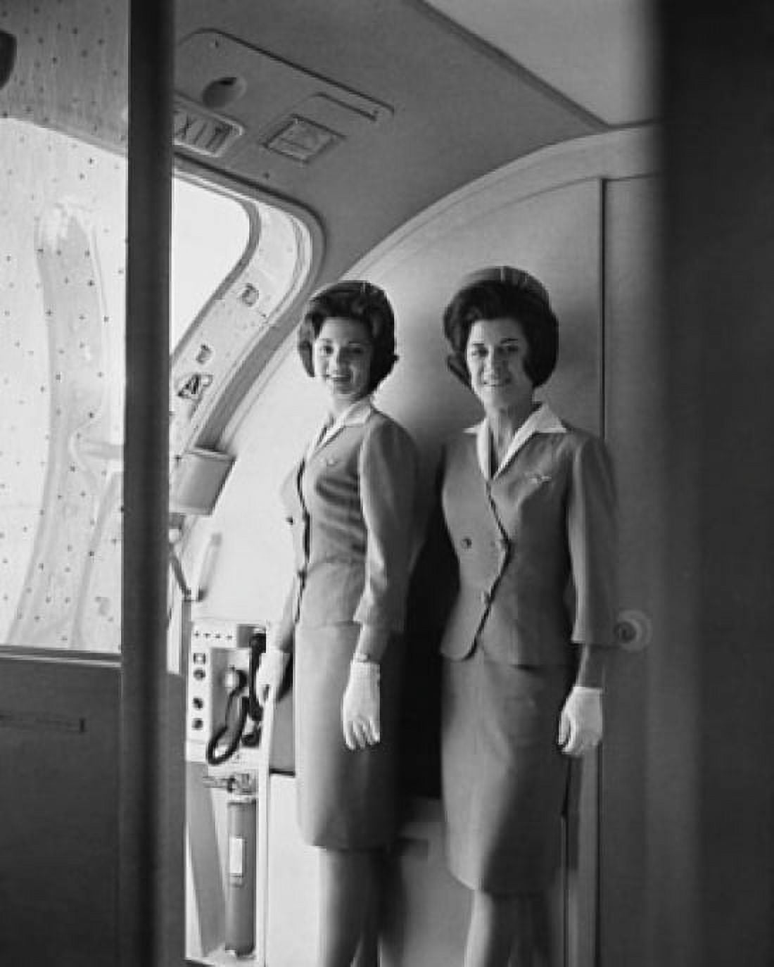 Two flight attendants standing on an airplane and smiling Canvas Art - (18 x 24)
