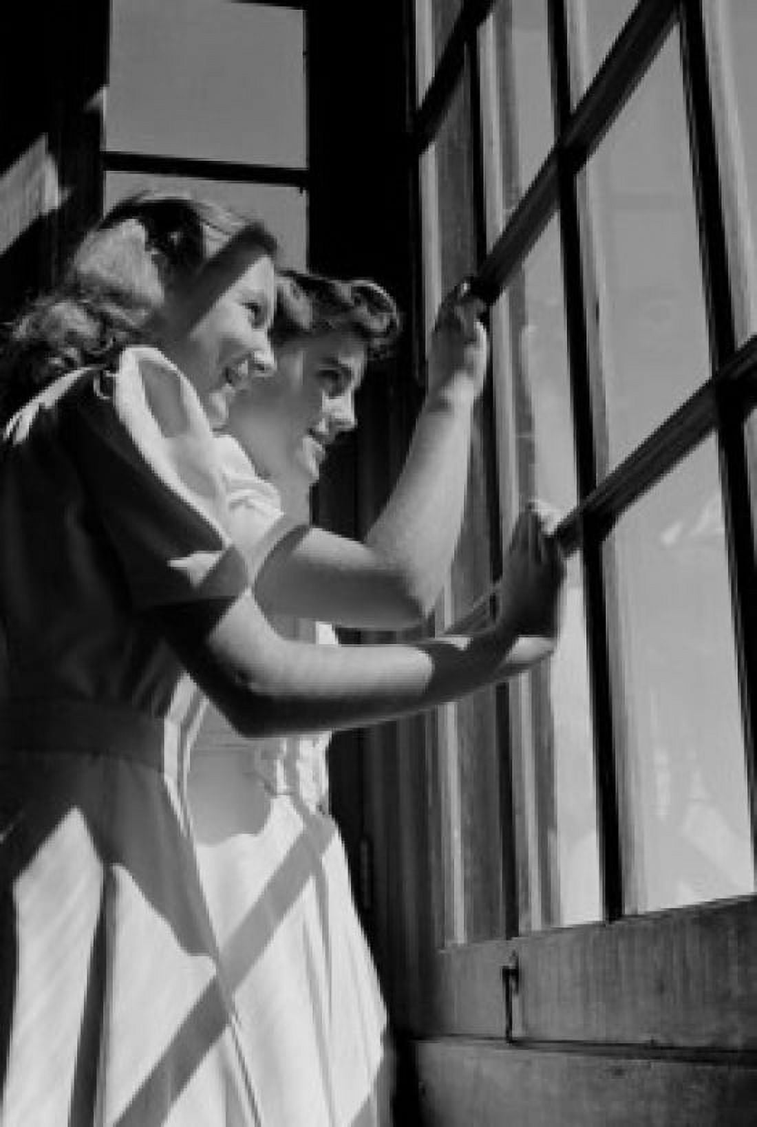 Two girls looking out window Canvas Art -  (24 x 36)