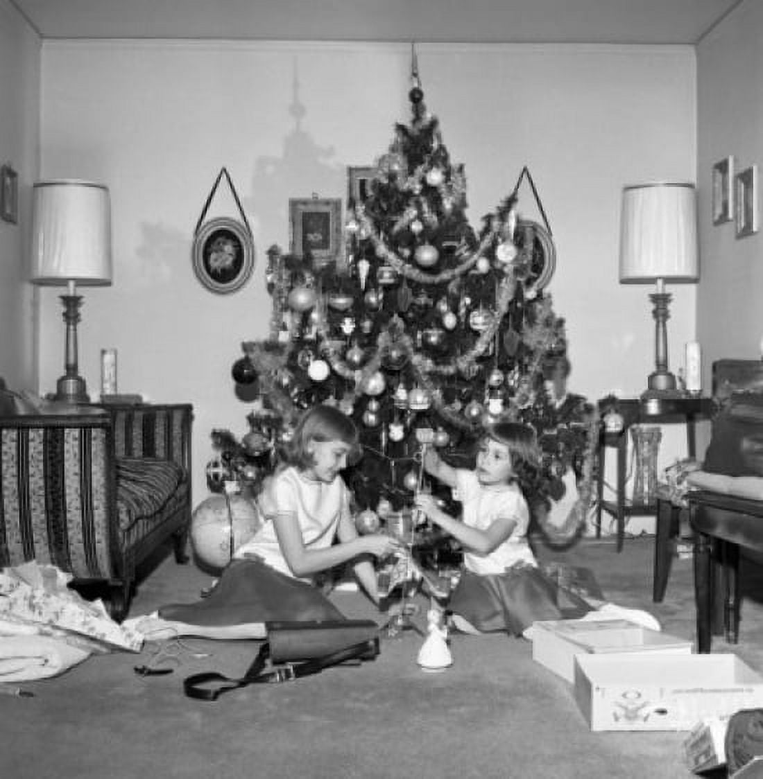 Two girls preparing Christmas tree Canvas Art - (24 x 36)