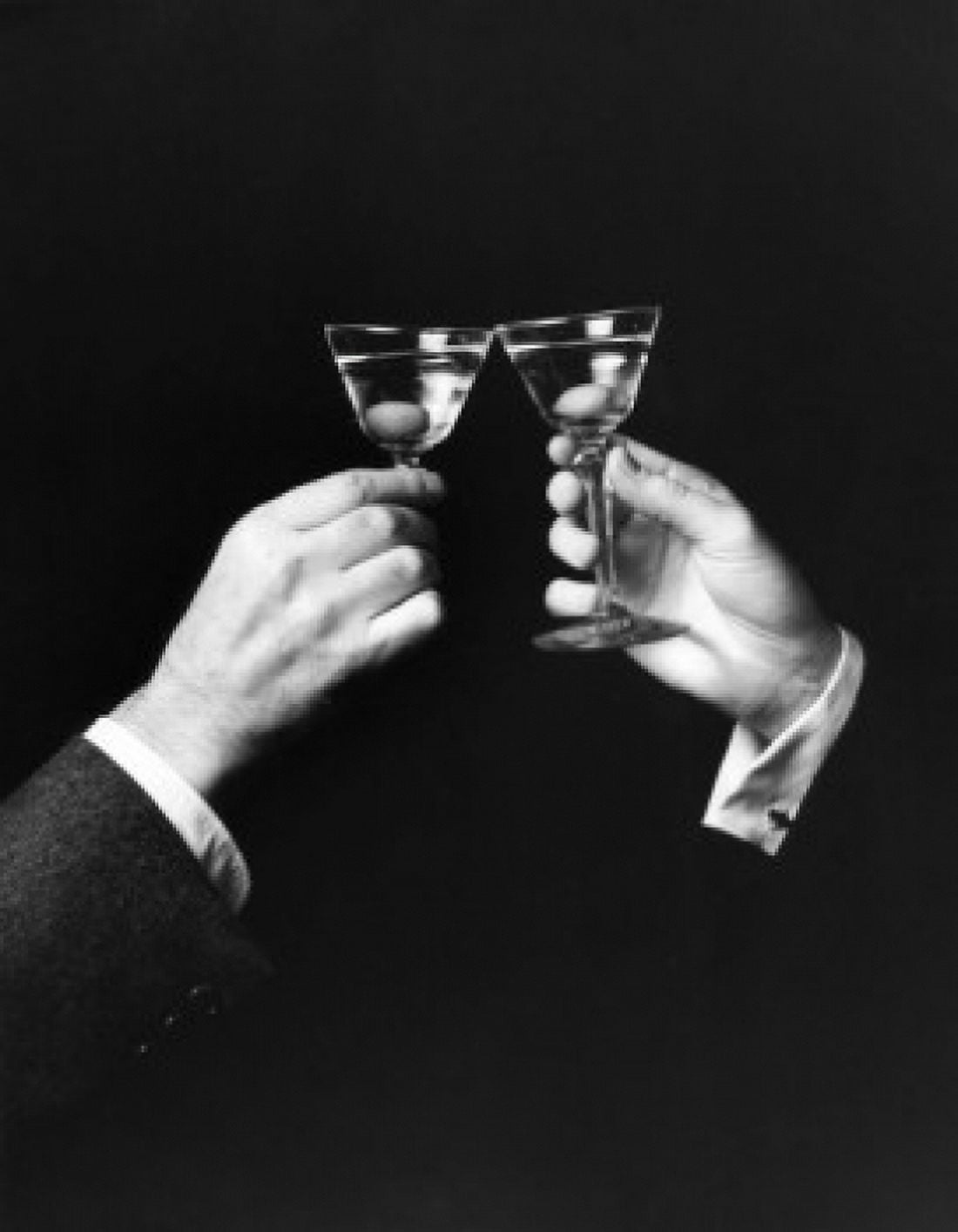 Two hands toasting with martini against black background Canvas Art - (24 x 36)