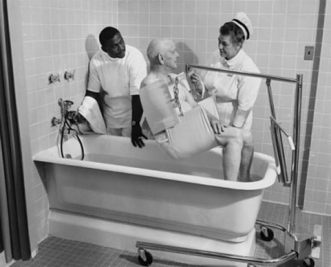 Two healthcare workers helping a patient bathe Canvas Art - (18 x 24)