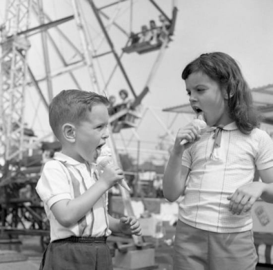 Two kids eating ice-creams in amusement park Canvas Art - (24 x 36)