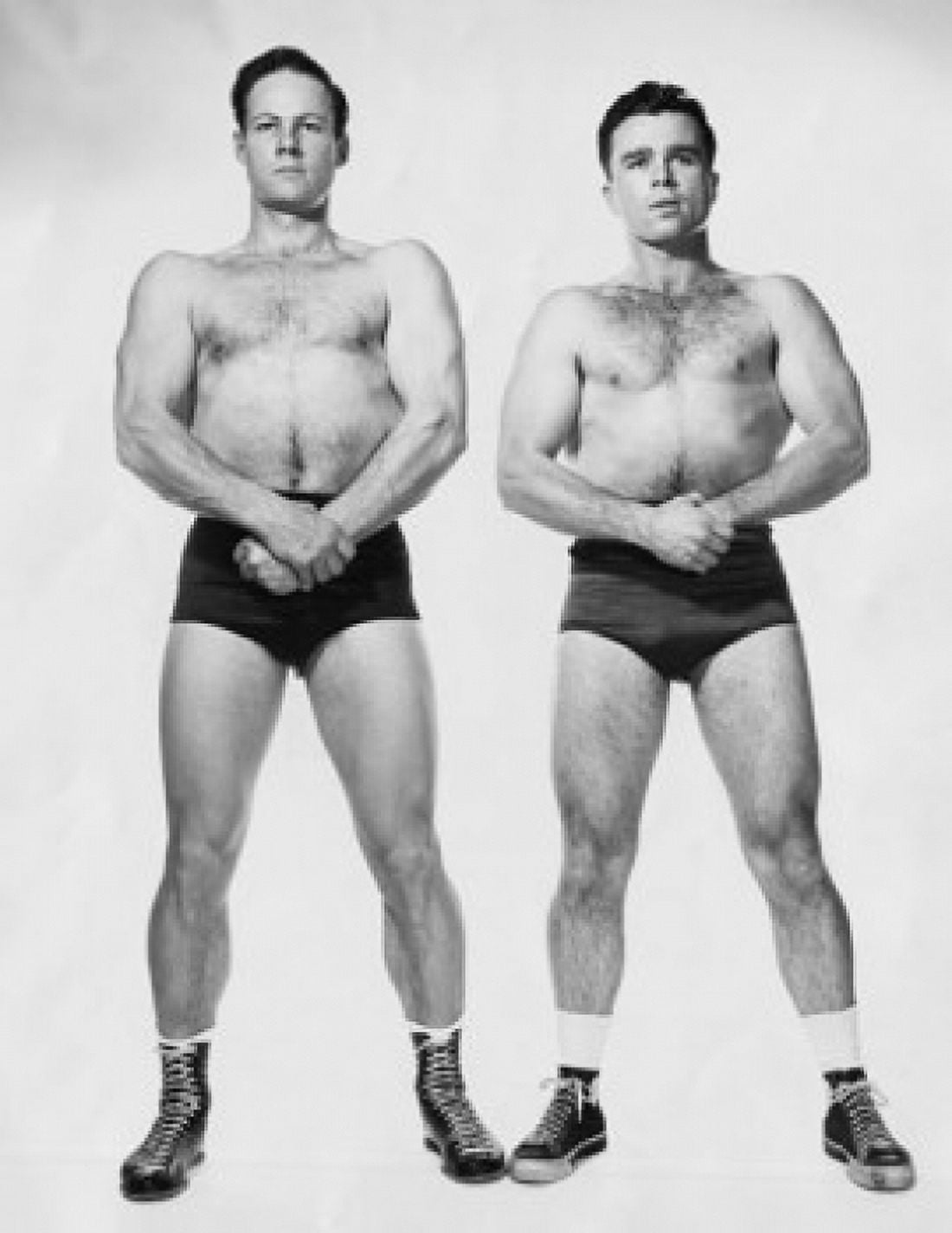 Two male body builders flexing their muscles Canvas Art - (18 x 24)