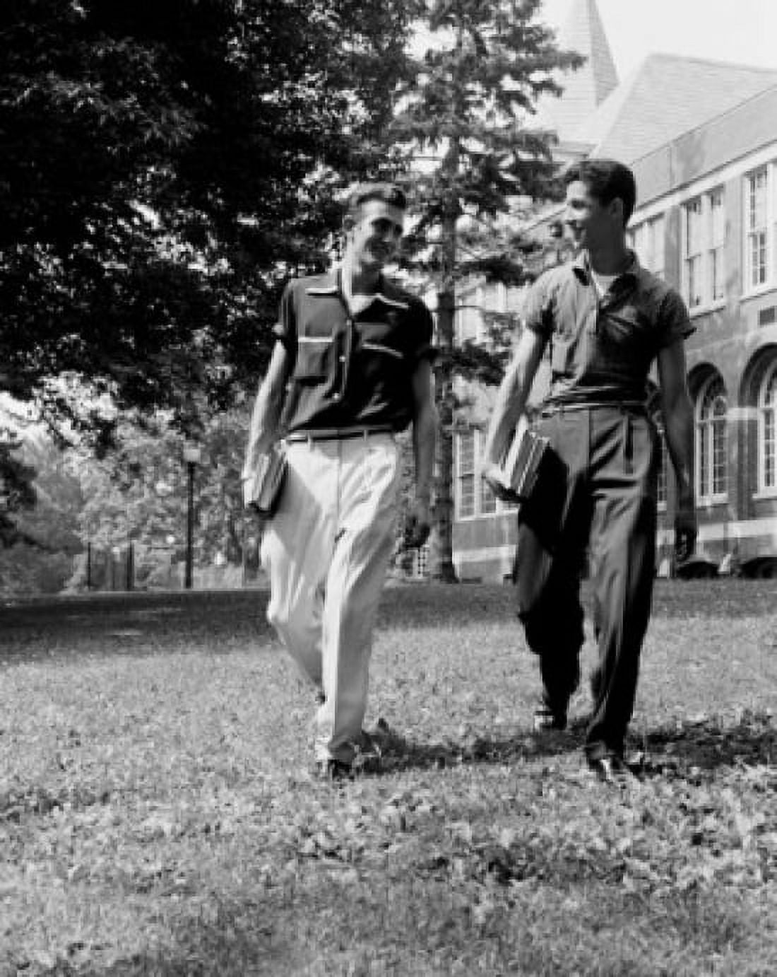 Two male students walking in front of university building and talking Canvas Art - (24 x 36)