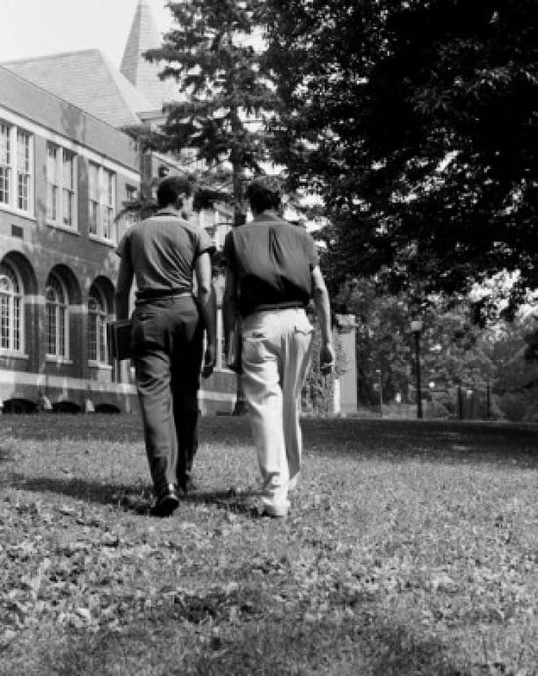 Two male students walking towards university building Canvas Art - (18 x 24)