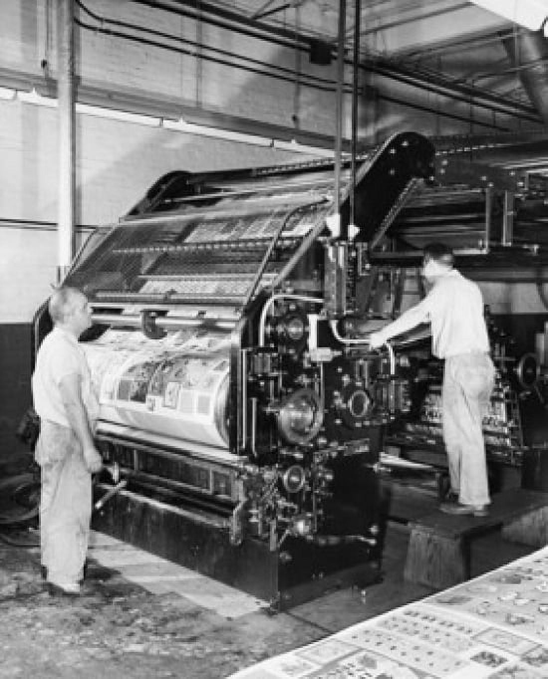 Two manual workers working on a printing press Canvas Art - (18 x 24)