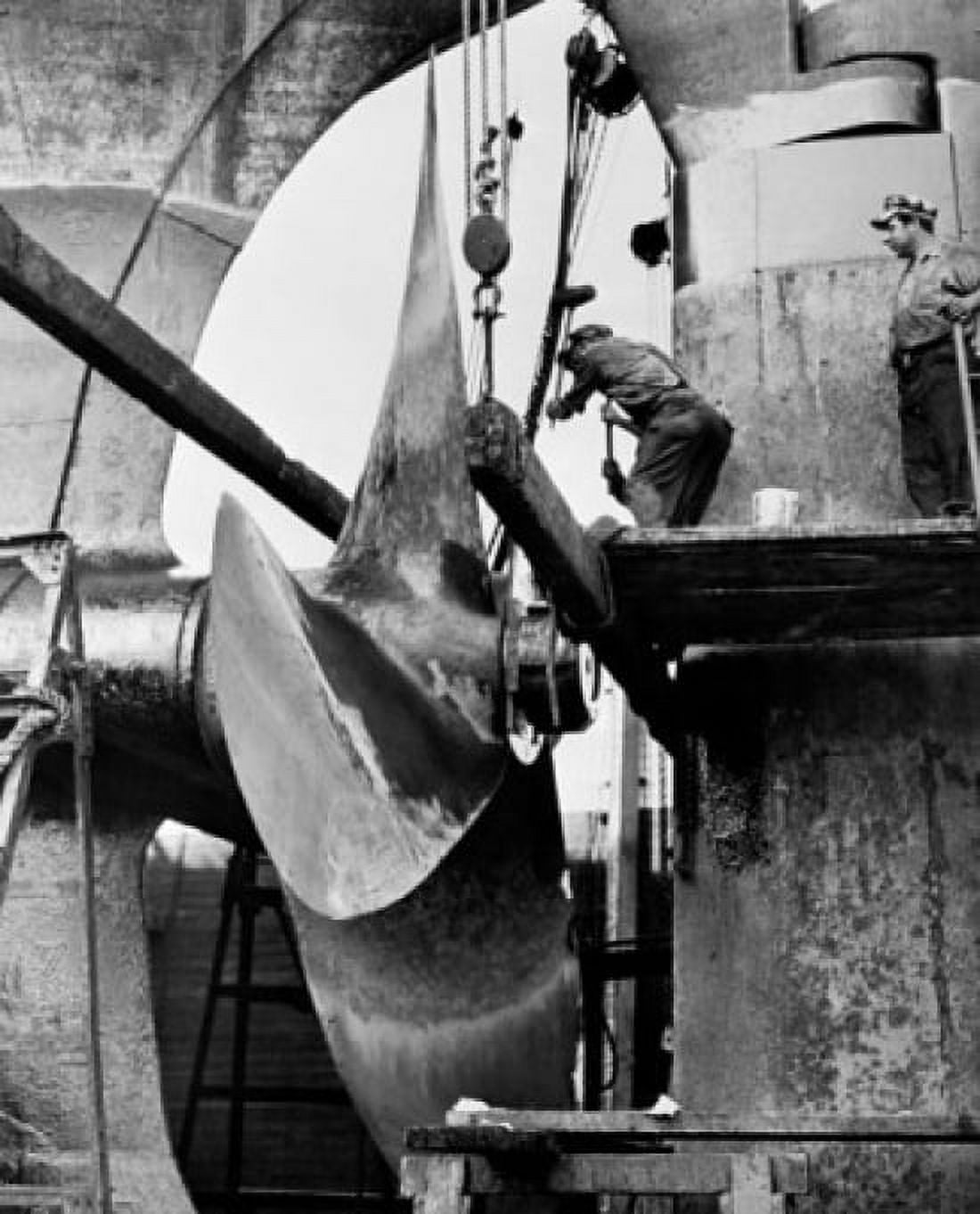 Two mature men working at rudder of an industrial ship Canvas Art - (18 x 24)