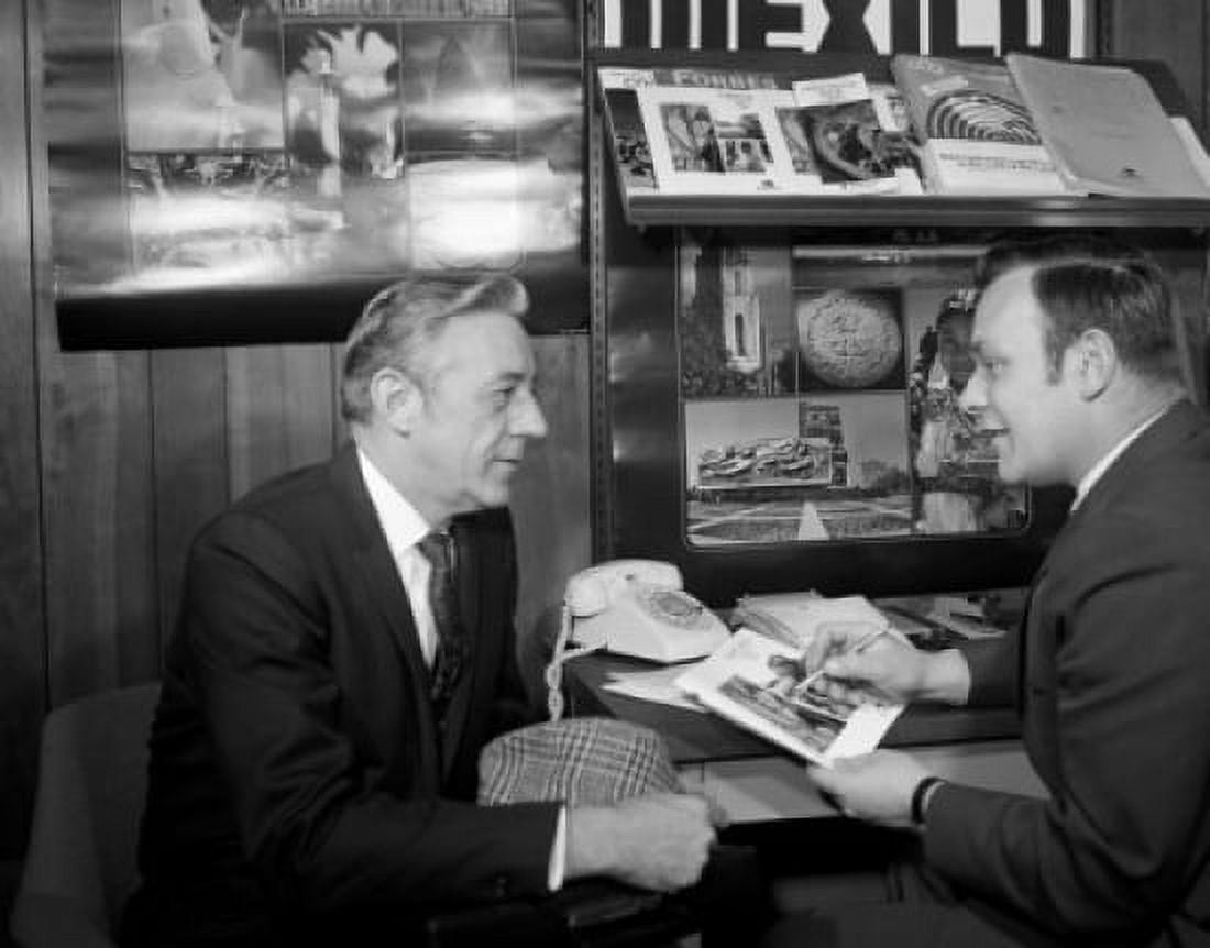 Two men talking in travel agency Canvas Art - (18 x 24)