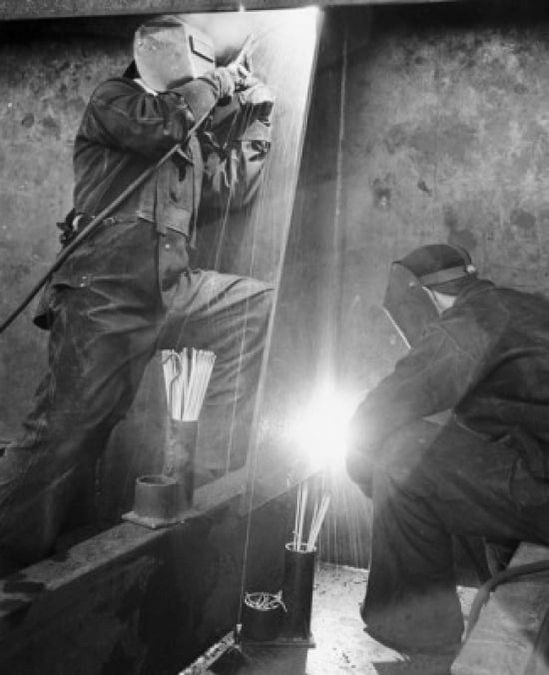 Two men welding Canvas Art - (24 x 36)