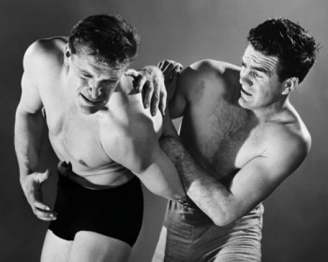 Two mid adult men wrestling Canvas Art - (18 x 24)