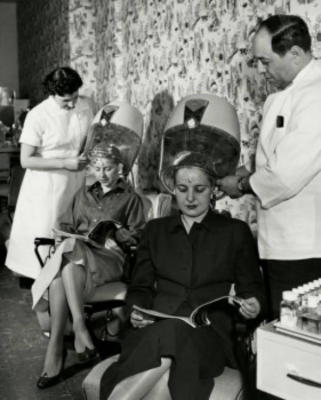 Two mid adult women sitting under dryers in hair salon Canvas Art -  (18 x 24)