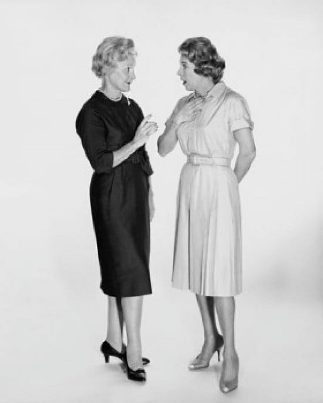 Two mid adult women talking to each other Canvas Art - (18 x 24)