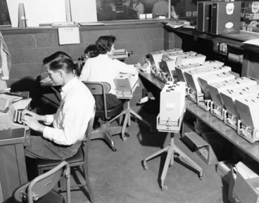 Two office workers working in an office Canvas Art - (24 x 36)