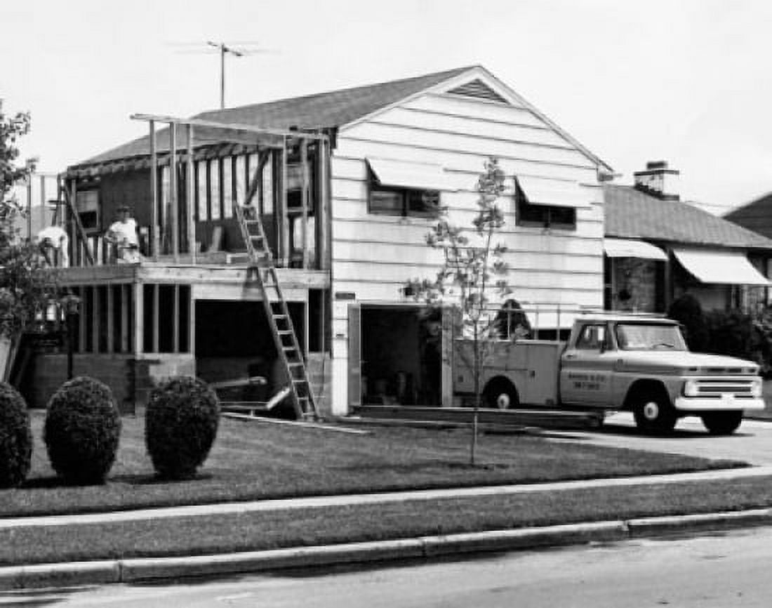 Two people constructing a house Canvas Art - (18 x 24)