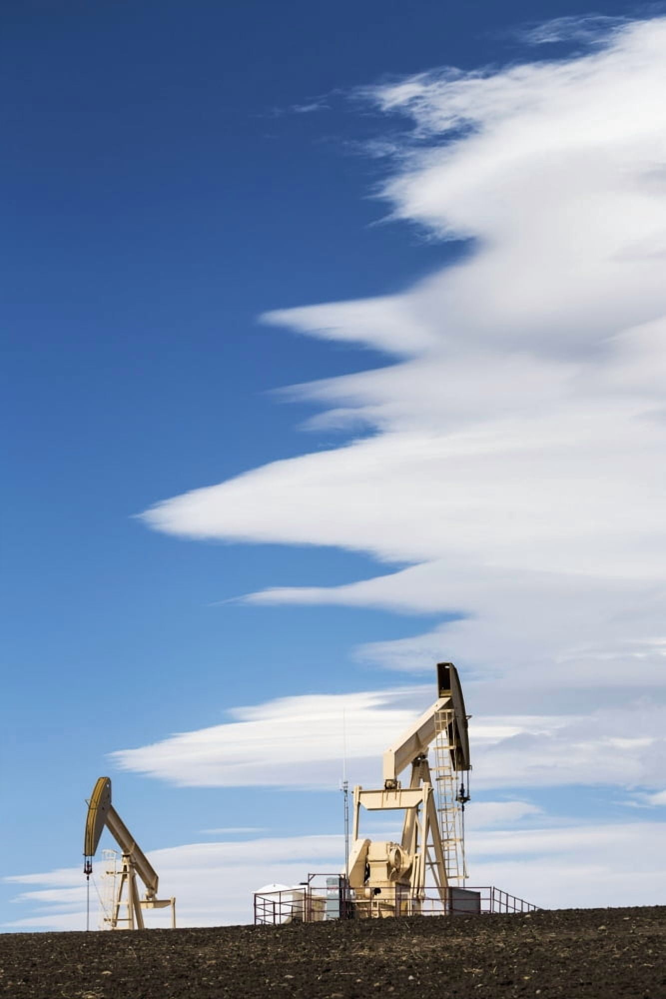 Two pumpjacks on a hill with dramatic clouds in the blue sky Alberta Canada Canvas Art - Michael Interisano Design Pics (12 x 19)