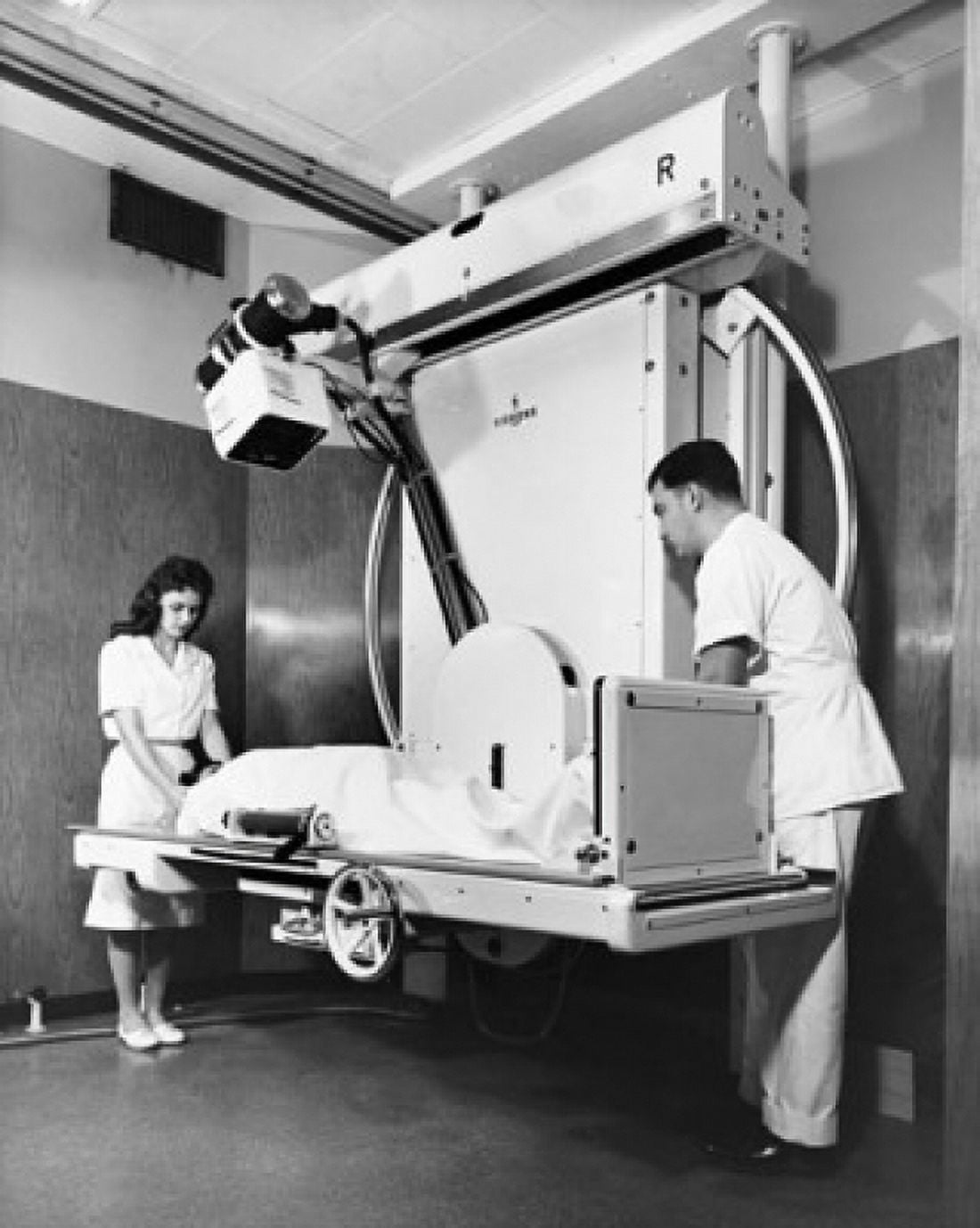 Two radiologists taking an x-ray of a patient Canvas Art - (24 x 36)