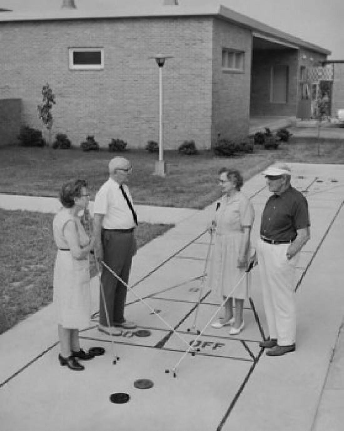 Two senior couples playing shuffleboard Canvas Art - (18 x 24)