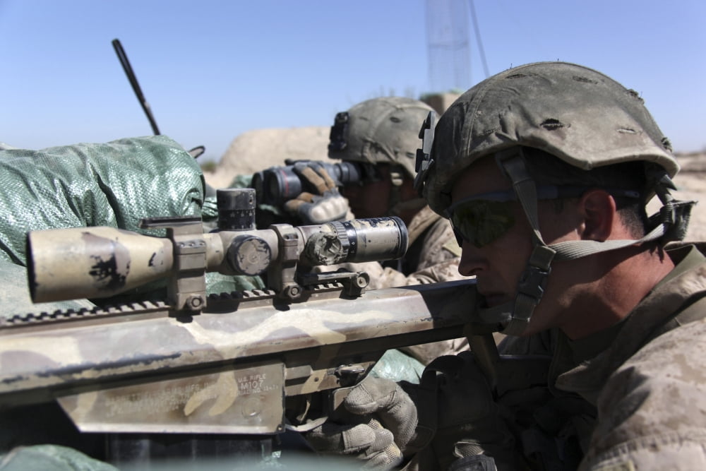 Two snipers provide overwatch as a squad of US Marines move out from their patrol base Canvas Art - Stocktrek Images (35 x 24)