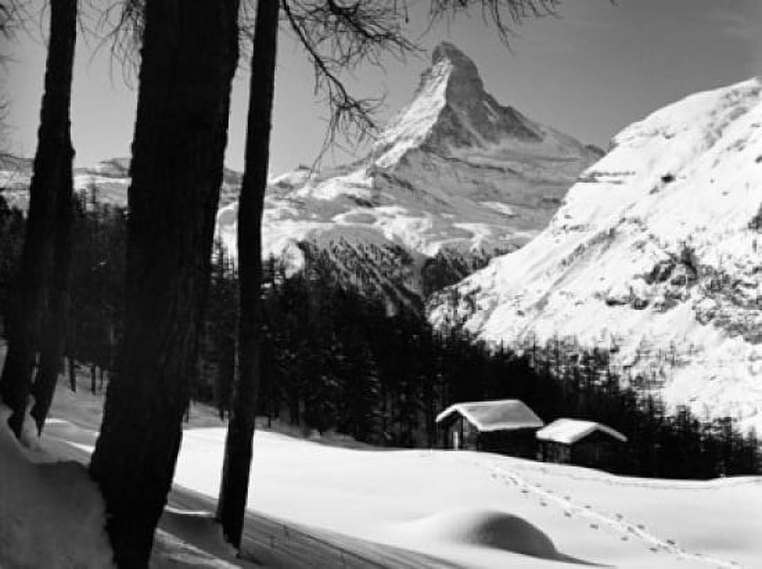 Two snow covered cottages in front of a mountain peak Matterhorn Switzerland Canvas Art - (18 x 24)