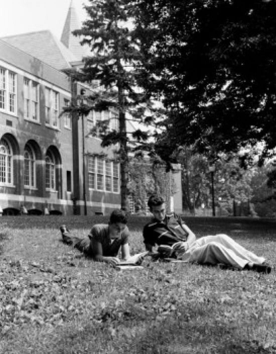 Two student lying on lawn and learning Canvas Art - (18 x 24)
