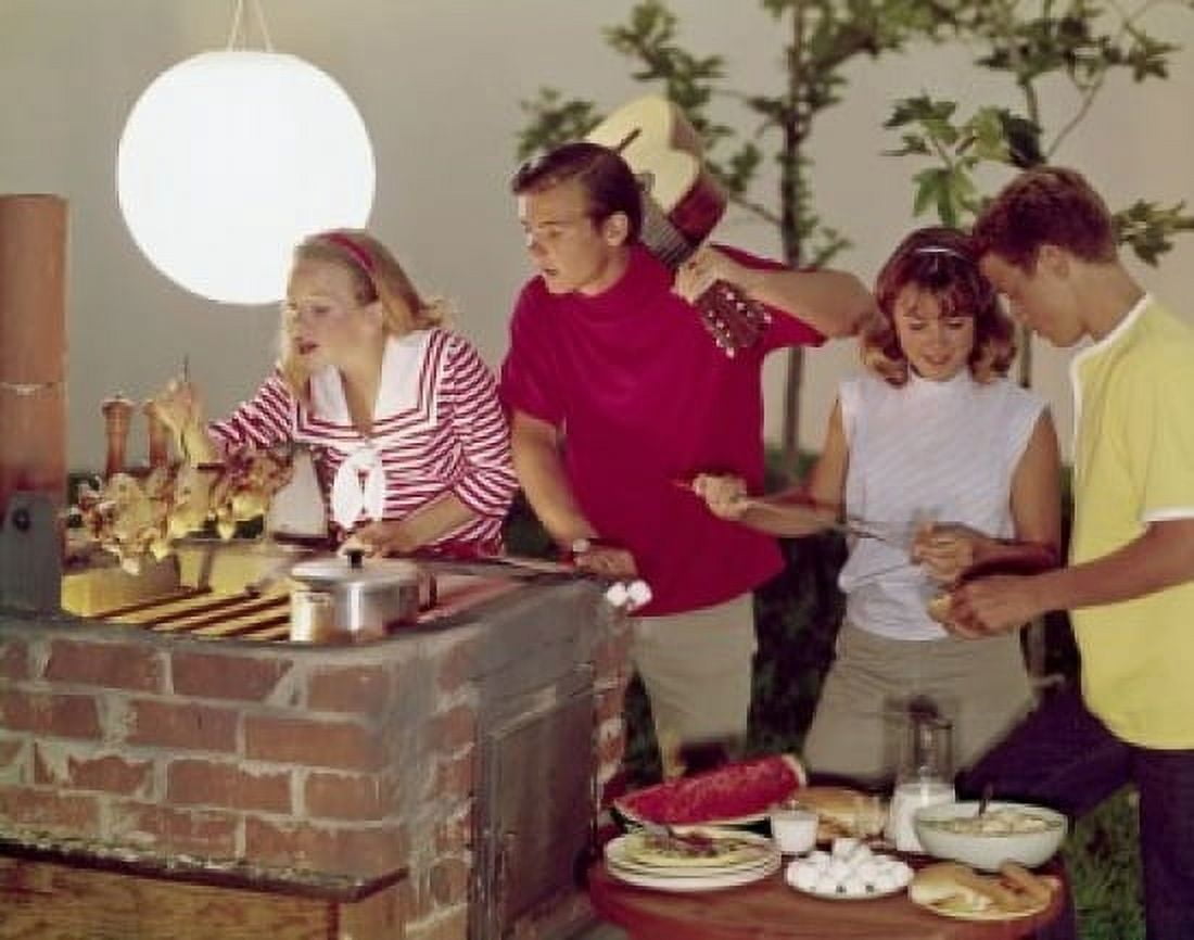 Two teenage couples cooking food at a party Canvas Art - (24 x 36)