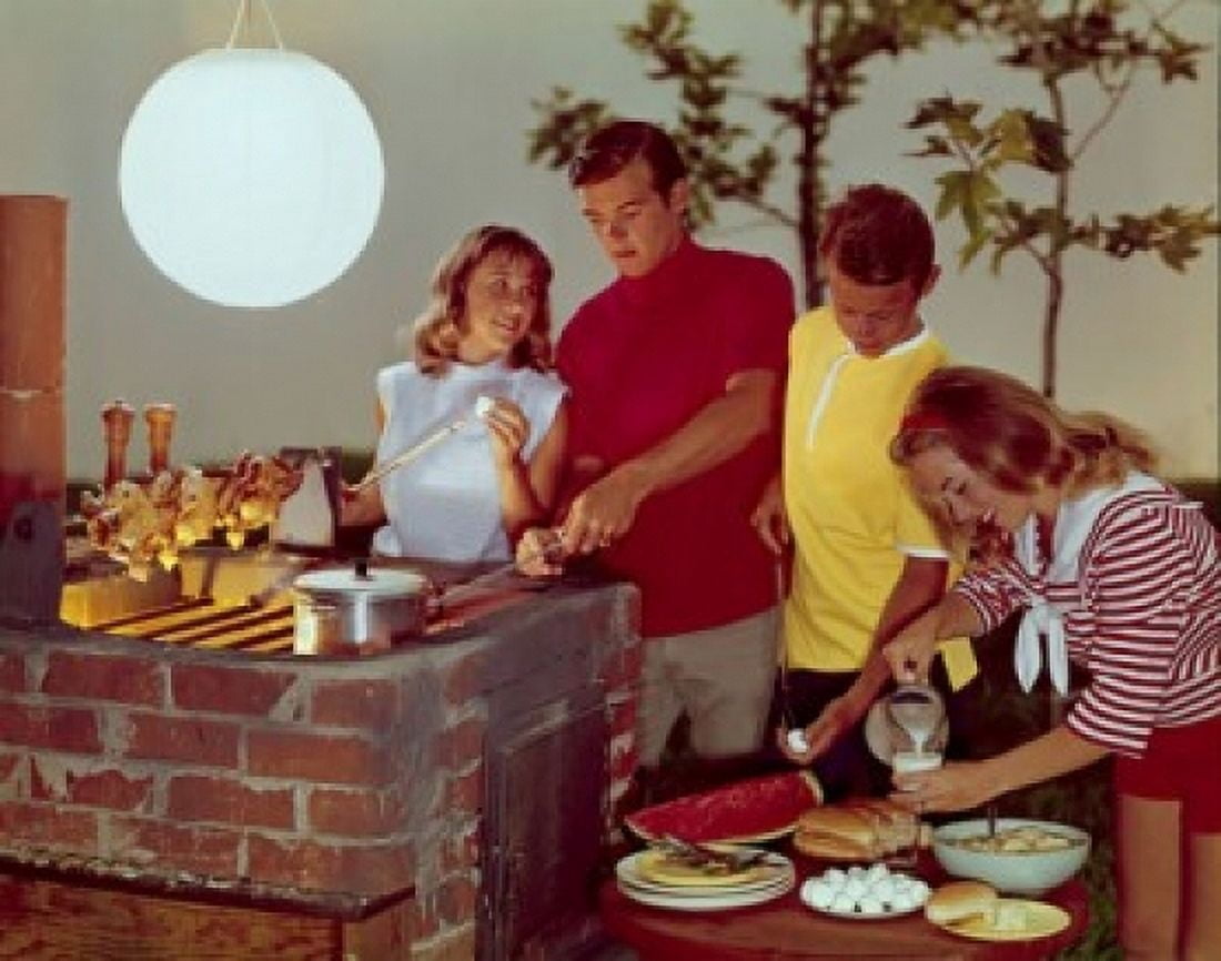 Two teenage couples preparing food on a barbecue grill Canvas Art - (24 x 36)