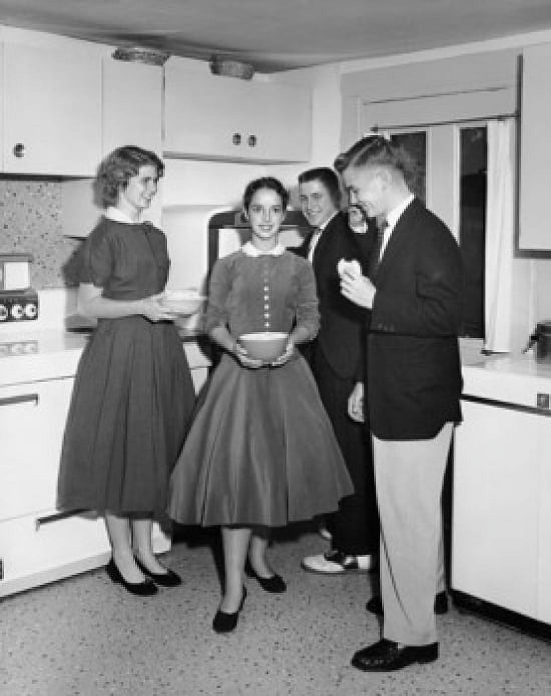 Two teenage couples standing in the kitchen and smiling Canvas Art - (24 x 36)