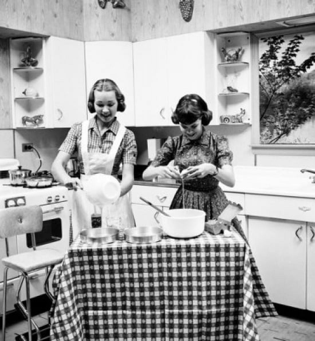 Two teenage girls preparing food in the kitchen Canvas Art - (24 x 36)