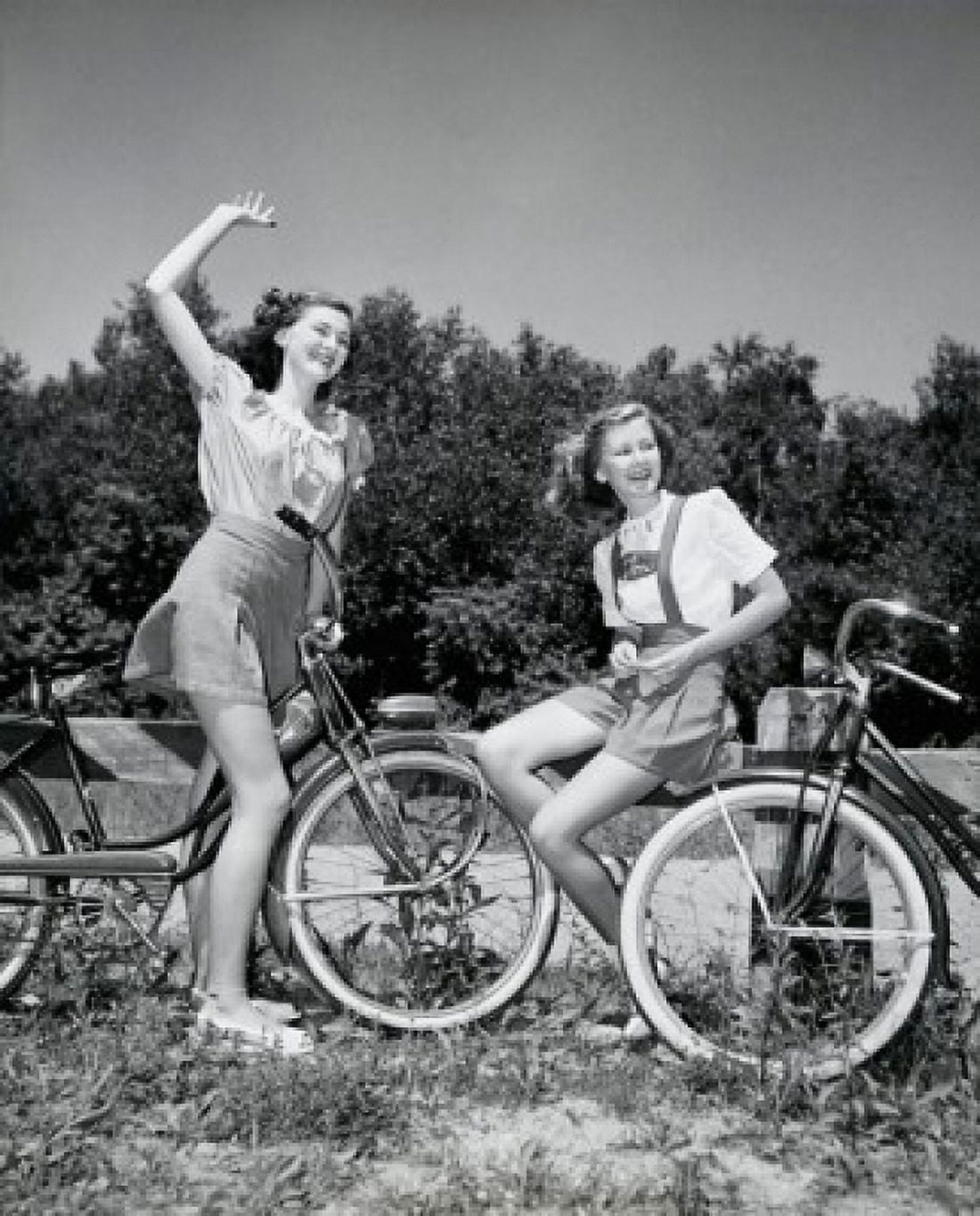 Two teenage girls with bicycles Canvas Art - (18 x 24)
