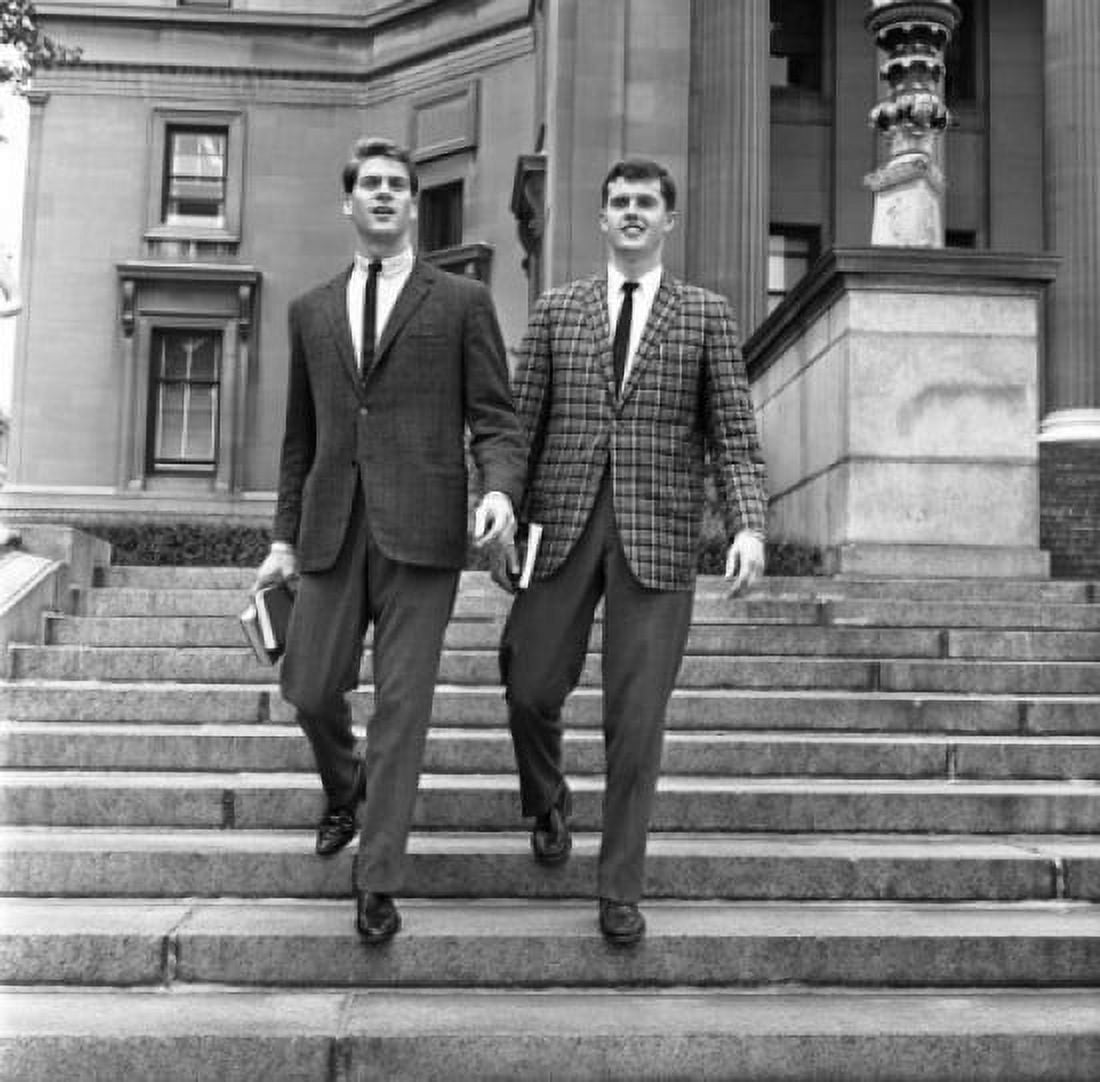 Two well dressed young men going down on stairs Canvas Art - (18 x 24)