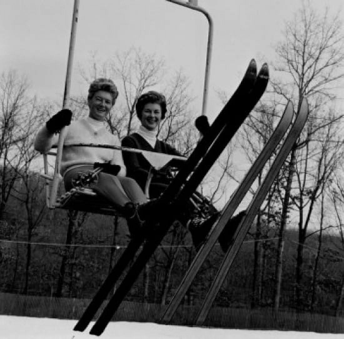 Two woman sitting ski lift looking at camera and smiling Canvas Art -  (24 x 36)