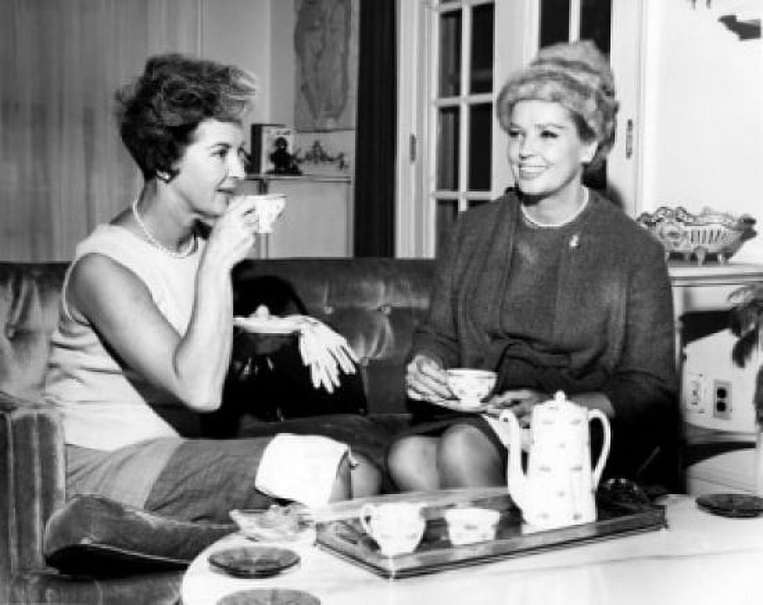Two women drinking tea and talking in living room Canvas Art - (24 x 36)