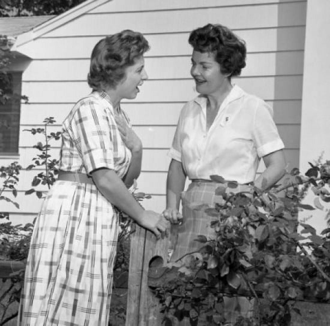 Two women talking over garden fence Canvas Art - (24 x 36)