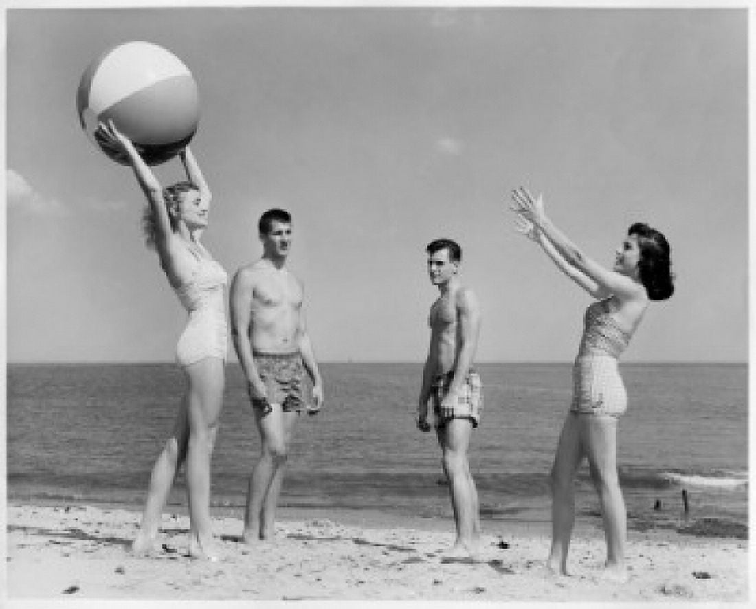 Two young couples playing with beach ball on beach Canvas Art - (18 x 24)