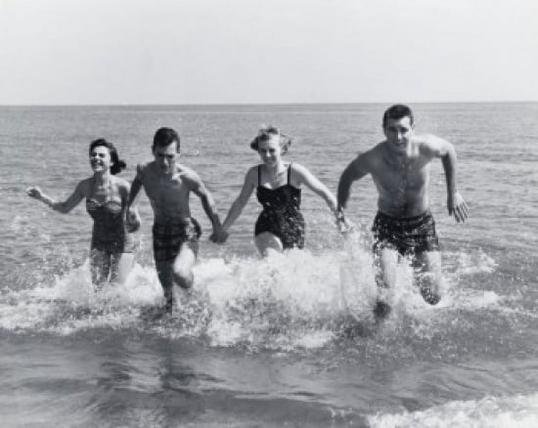 Two young couples running in water Canvas Art - (24 x 36)