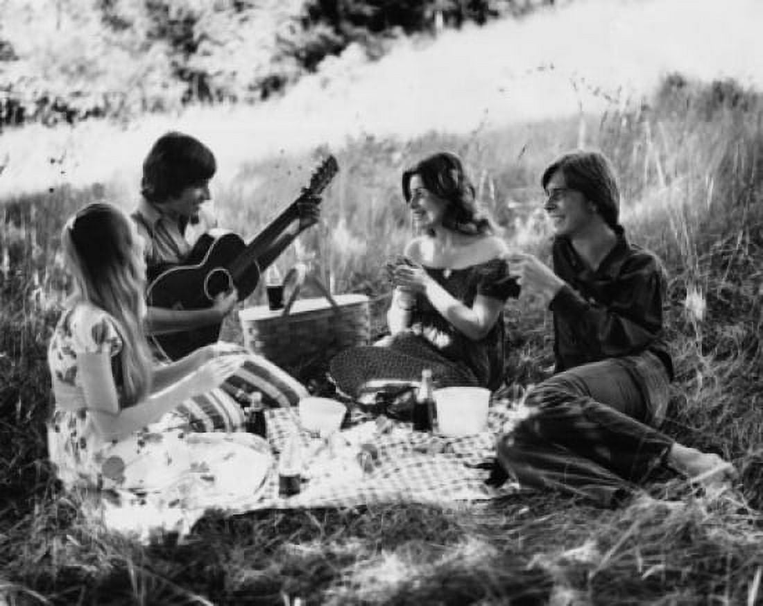 Two young couples sitting in a park Canvas Art - (24 x 36)