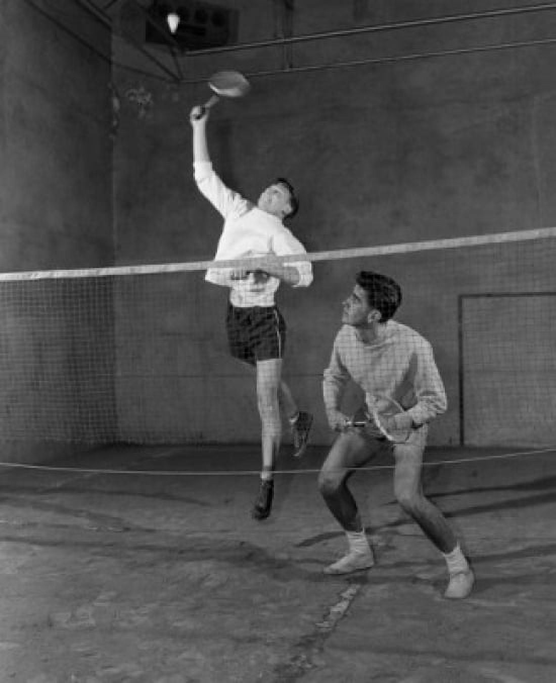 Two young men playing badminton in sports hall Canvas Art - (18 x 24)