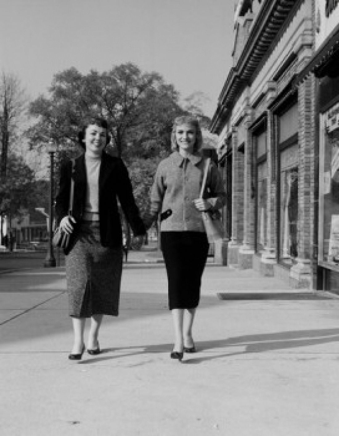 Two young woman walking and holding hands Canvas Art - (18 x 24)