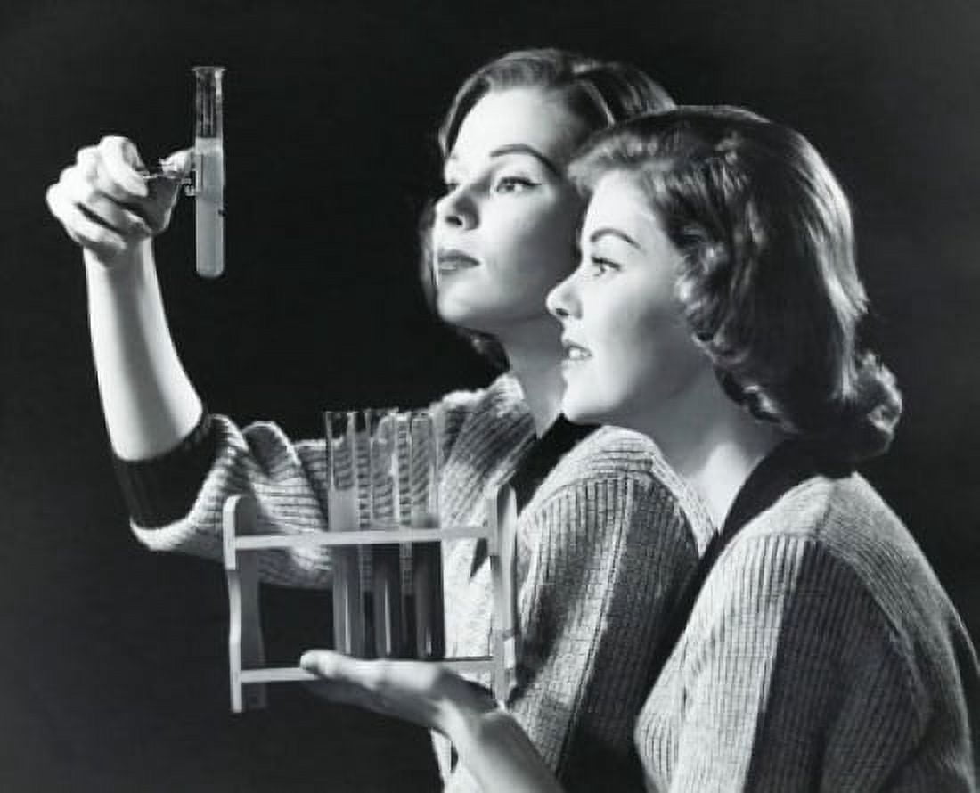 Two young women examining a solution in a test tube Canvas Art - (24 x 36)