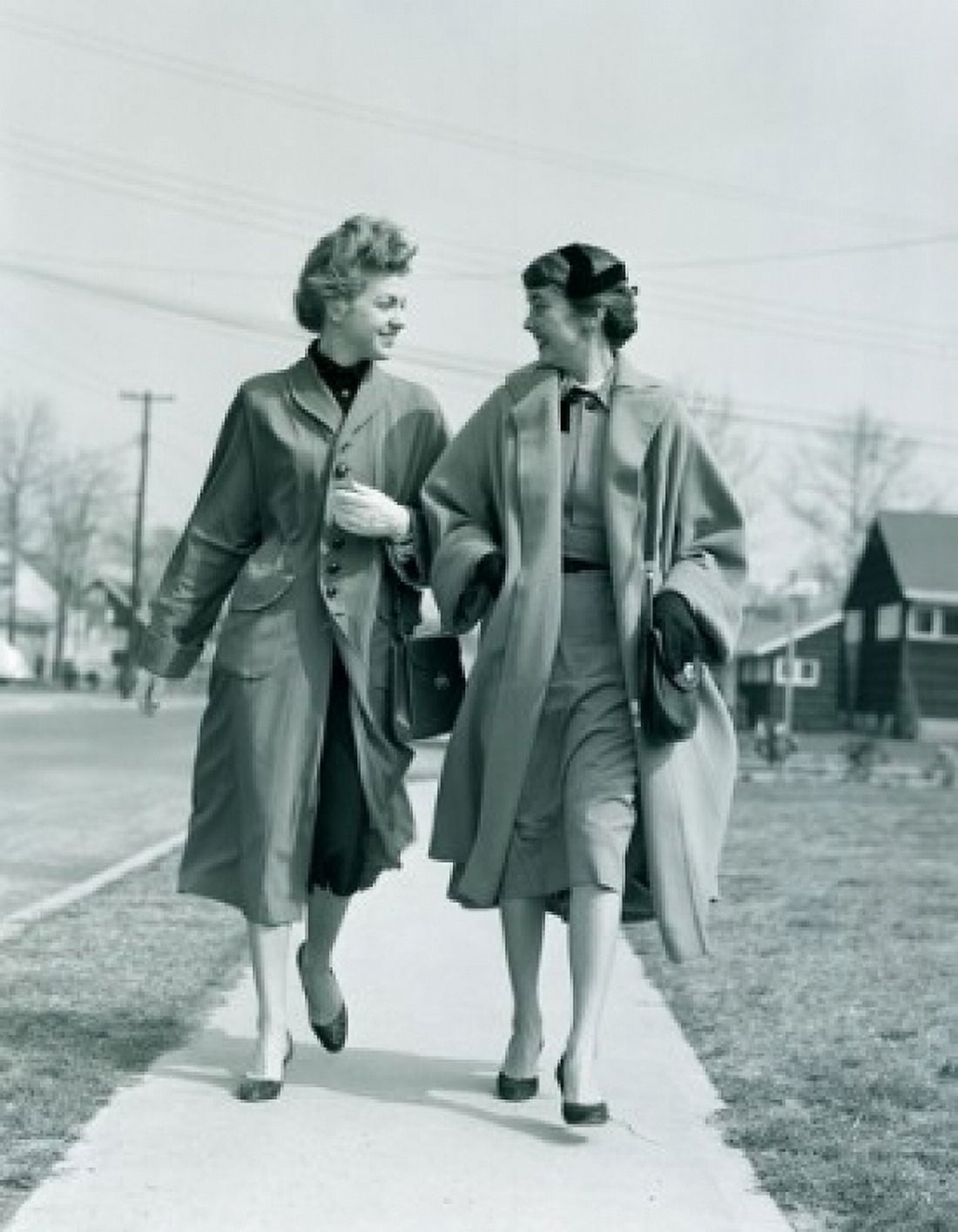 Two young women walking on pavement Canvas Art - (18 x 24)