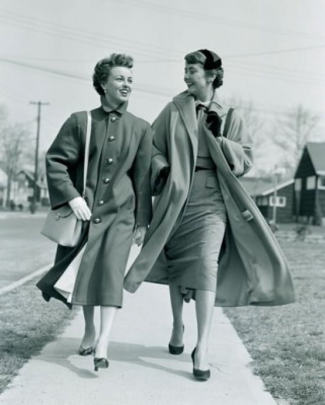 Two young women walking on pavement Canvas Art - (24 x 36)