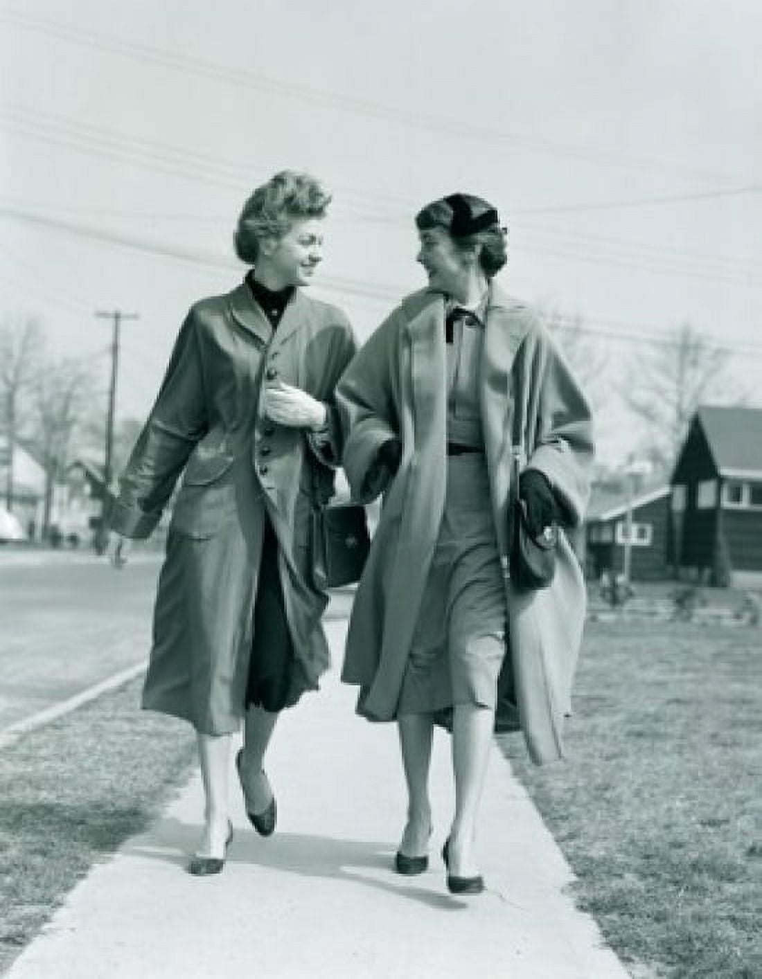 Two young women walking on pavement Canvas Art - (24 x 36)