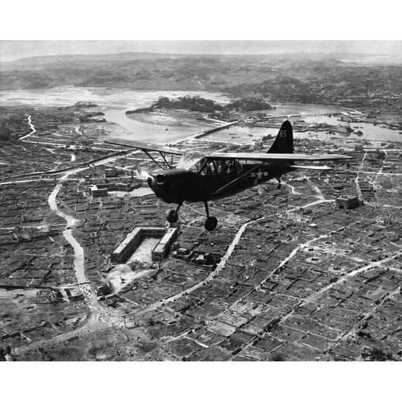 U.S. Marine Observation Plane Flies Low Over Naha History (24 x 18)