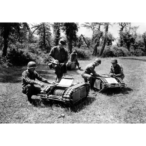 U.S. Soldiers Inspect German Tactical Mini-Tracked Vehicles. The Robots Carried Bombs Toward Invading Allied Troops On